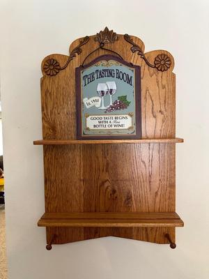 WOODEN WALL SHELF WITH A TASTING ROOM SIGN