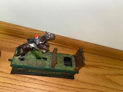 COOL CAST-IRON SHOWJUMPER BANK AND WATER WELL PUMP
