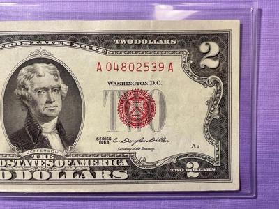 Nicely Circulated EF/AU Condition Series of 1963 Two Dollar Red Star Note Serial Number #A04802539A as Pictured.
