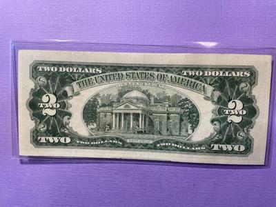 Nicely Circulated EF/AU Condition Series of 1963 Two Dollar Red Star Note Serial Number #A04802539A as Pictured.