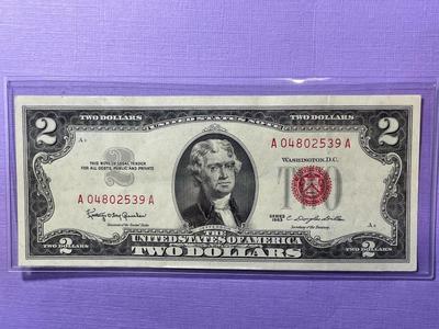 Nicely Circulated EF/AU Condition Series of 1963 Two Dollar Red Star Note Serial Number #A04802539A as Pictured.