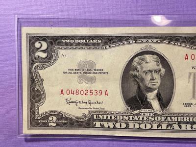 Nicely Circulated EF/AU Condition Series of 1963 Two Dollar Red Star Note Serial Number #A04802539A as Pictured.