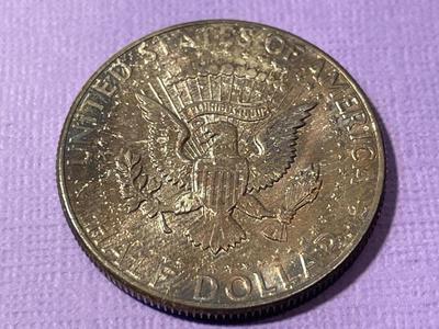 1964-P END OF A ROLL TONED BU KENNEDY SILVER HALF DOLLAR AS PICTURED. FREE DOMESTIC SHIPPING.