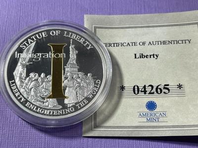 STATUE OF LIBERTY/IMMIGRATION PROOF SILVER-TONE MEDAL BY THE AMERICAN MINT AS PICTURED.