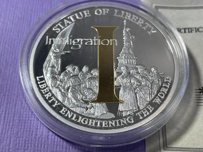 STATUE OF LIBERTY/IMMIGRATION PROOF SILVER-TONE MEDAL BY THE AMERICAN MINT AS PICTURED.