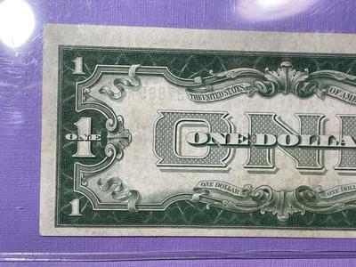 SERIES OF 1928 CRISP AU/UNCIRCULATED "FUNNY BACK" SILVER CERTIFICATE AS PICTURED.
