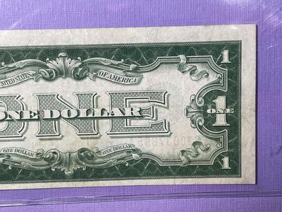 SERIES OF 1928 CRISP AU/UNCIRCULATED "FUNNY BACK" SILVER CERTIFICATE AS PICTURED.