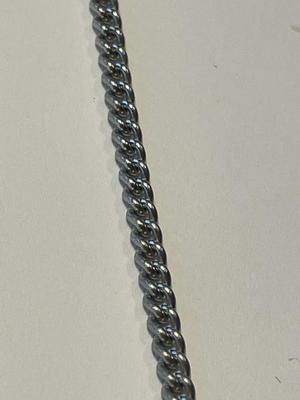 Vintage Avon Bengal Tiger Necklace Etched Scrimshaw Pendant 1979 on a Silver-tone 20" Chain in Good Preowned Condition.