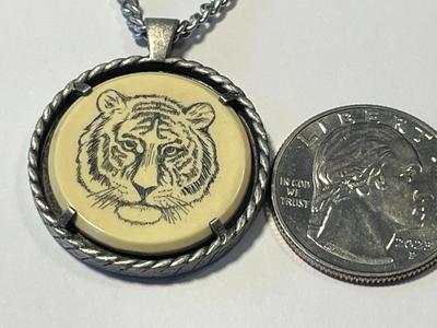 Vintage Avon Bengal Tiger Necklace Etched Scrimshaw Pendant 1979 on a Silver-tone 20" Chain in Good Preowned Condition.