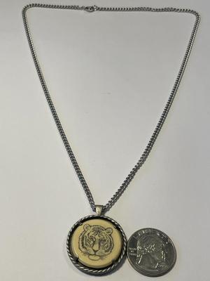 Vintage Avon Bengal Tiger Necklace Etched Scrimshaw Pendant 1979 on a Silver-tone 20" Chain in Good Preowned Condition.