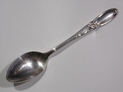 Community silver plate. "White Orchid" baby spoon.