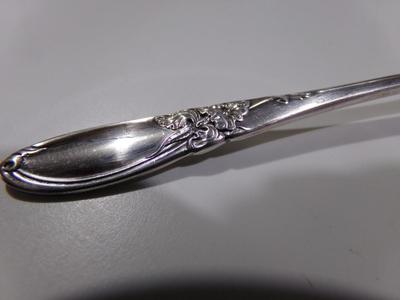 Community silver plate. "White Orchid" baby spoon.