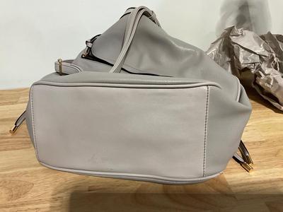 Large gray purse, very soft feel like leather but not sure