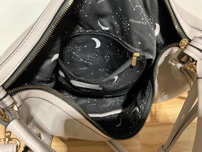 Large gray purse, very soft feel like leather but not sure