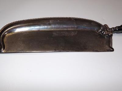 A serving device, maybe for cheese?