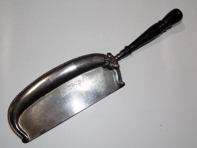 A serving device, maybe for cheese?