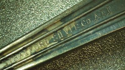 Stratford Silver Co. AXI silver plate. Looks like a sugar server spoon