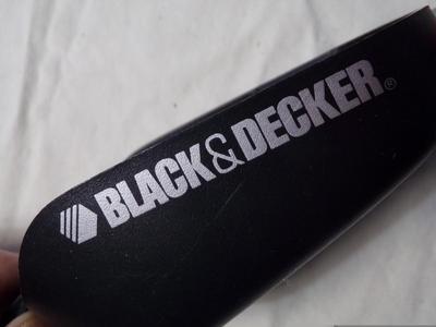 Black&Decker gizmo with cutter blades and a hanger bracket.