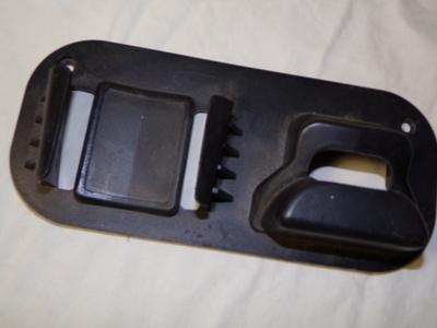 Black&Decker gizmo with cutter blades and a hanger bracket.