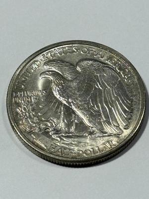 1941-P BRILLIANT UNCIRCULATED CONDITION WALKING LIBERTY SILVER HALF DOLLAR AS PICTURED.