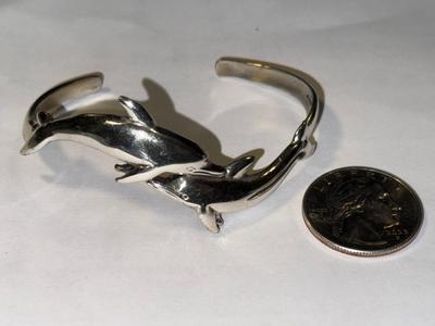 VINTAGE PREOWNED STERLING SILVER FIGURAL DOLPHIN CUFF BRACELET 17.7 GRAMS TW STANDARD SIZE 7".