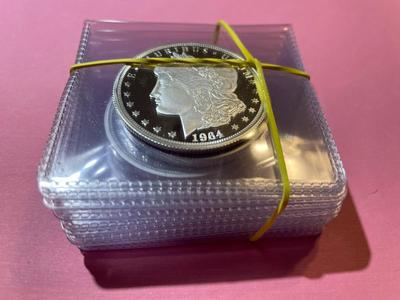 Lot of (7) 1964 Cook Islands Morgan Proof Dollar Tribute Copy Coins from 2020 as Pictured.