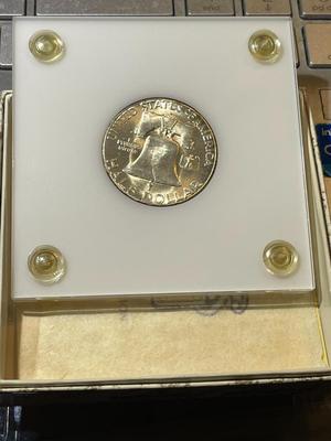 1951-S CHOICE BU CONDITION/TONED RIMS FRANKLIN SILVER HALF DOLLAR IN A CAPITAL HOLDER AS PICTURED.