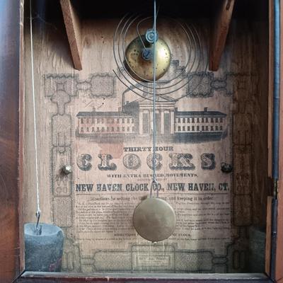 LOT 49: Antique New Haven Clock Co. Reverse Painted Thirty Hour Shelf Clock