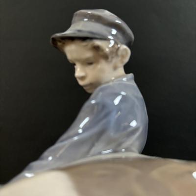 LOT 102: Royal Copenhagen Figurine #772: Boy with Stubborn Calf