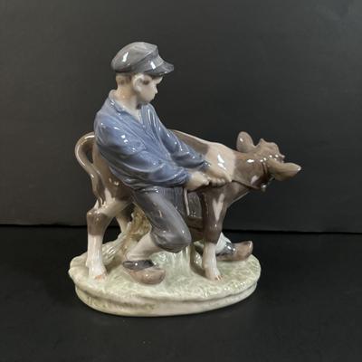 LOT 102: Royal Copenhagen Figurine #772: Boy with Stubborn Calf