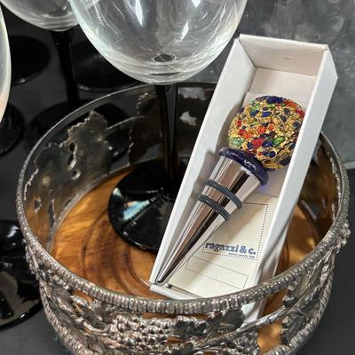 LOT 203: Arthur Court Grape Cluster Canister, Ragazzi & Co. Bottle Stoppers, Grape Cluster Bottle Coasters, Black Stemware w/Matching...