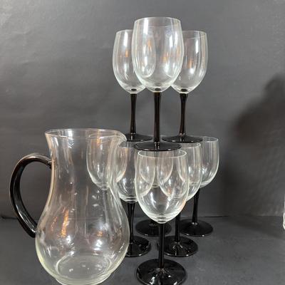 LOT 203: Arthur Court Grape Cluster Canister, Ragazzi & Co. Bottle Stoppers, Grape Cluster Bottle Coasters, Black Stemware w/Matching...