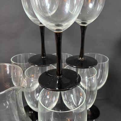 LOT 203: Arthur Court Grape Cluster Canister, Ragazzi & Co. Bottle Stoppers, Grape Cluster Bottle Coasters, Black Stemware w/Matching...
