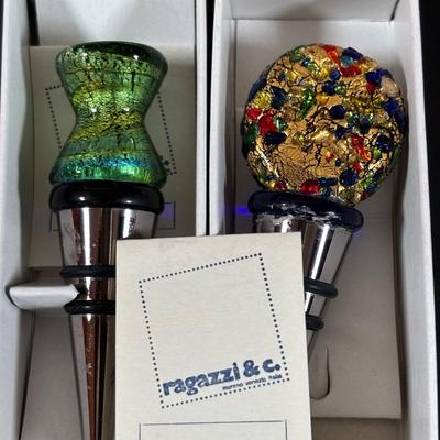 LOT 203: Arthur Court Grape Cluster Canister, Ragazzi & Co. Bottle Stoppers, Grape Cluster Bottle Coasters, Black Stemware w/Matching...