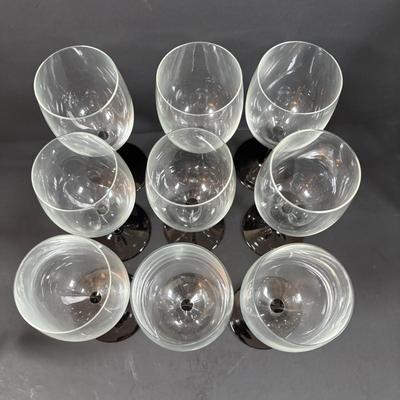 LOT 203: Arthur Court Grape Cluster Canister, Ragazzi & Co. Bottle Stoppers, Grape Cluster Bottle Coasters, Black Stemware w/Matching...