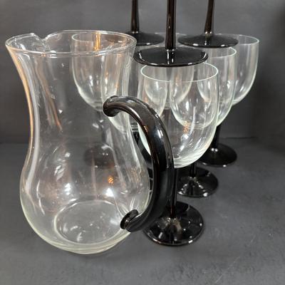 LOT 203: Arthur Court Grape Cluster Canister, Ragazzi & Co. Bottle Stoppers, Grape Cluster Bottle Coasters, Black Stemware w/Matching...