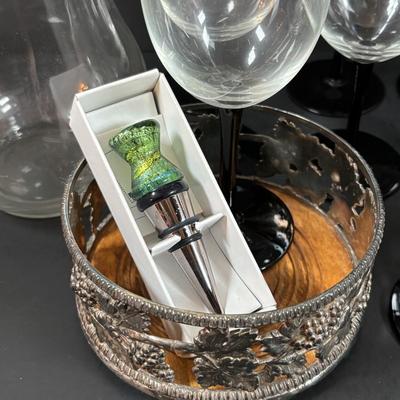 LOT 203: Arthur Court Grape Cluster Canister, Ragazzi & Co. Bottle Stoppers, Grape Cluster Bottle Coasters, Black Stemware w/Matching...