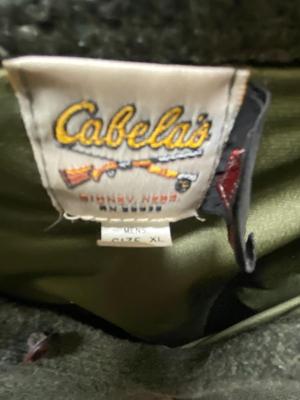 SIZE 10 CABELA’S BOOTS, WINDPROOF SWEATER, ORVIS HUNTING VEST, DUCK CALL & GLOVES