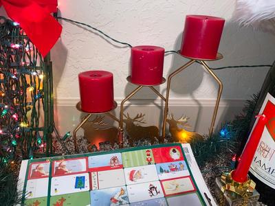 CHRISTMAS DECORATIONS, ALONG WITH THE BIGGEST CHAMPAGNE BOTTLE WE’VE EVER SEEN!