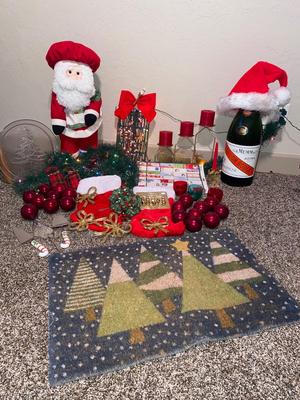 CHRISTMAS DECORATIONS, ALONG WITH THE BIGGEST CHAMPAGNE BOTTLE WE’VE EVER SEEN!