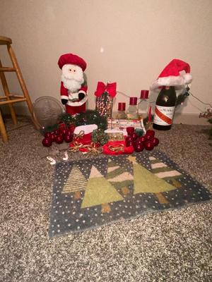 CHRISTMAS DECORATIONS, ALONG WITH THE BIGGEST CHAMPAGNE BOTTLE WE’VE EVER SEEN!