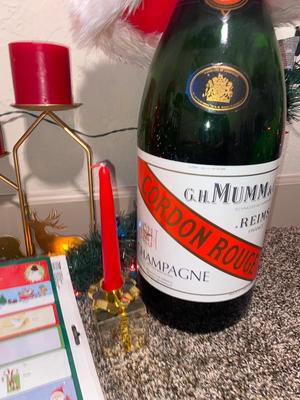 CHRISTMAS DECORATIONS, ALONG WITH THE BIGGEST CHAMPAGNE BOTTLE WE’VE EVER SEEN!