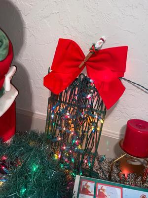 CHRISTMAS DECORATIONS, ALONG WITH THE BIGGEST CHAMPAGNE BOTTLE WE’VE EVER SEEN!