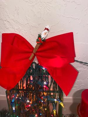 CHRISTMAS DECORATIONS, ALONG WITH THE BIGGEST CHAMPAGNE BOTTLE WE’VE EVER SEEN!