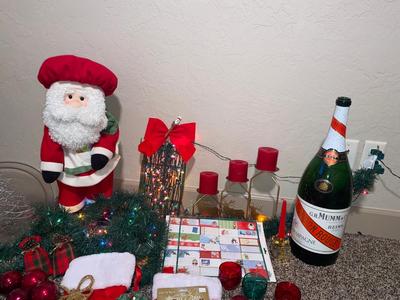 CHRISTMAS DECORATIONS, ALONG WITH THE BIGGEST CHAMPAGNE BOTTLE WE’VE EVER SEEN!