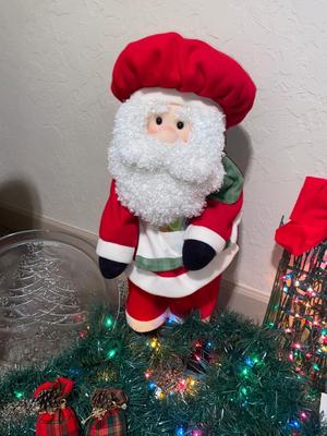 CHRISTMAS DECORATIONS, ALONG WITH THE BIGGEST CHAMPAGNE BOTTLE WE’VE EVER SEEN!