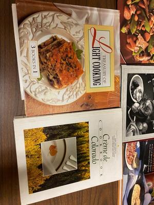 VARIETY OF COOKBOOK’S, A CHEF’S HAT AND KITCHEN GADGETS