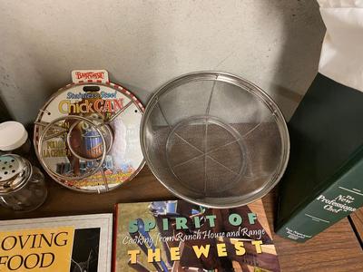 VARIETY OF COOKBOOK’S, A CHEF’S HAT AND KITCHEN GADGETS