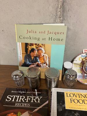 VARIETY OF COOKBOOK’S, A CHEF’S HAT AND KITCHEN GADGETS