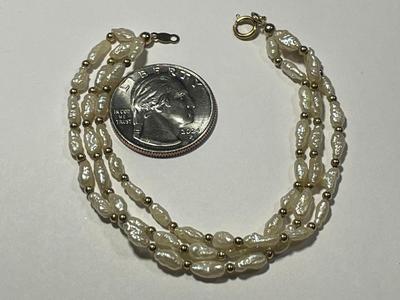 Vintage Preowned 14k Freshwater Pearl Triple Strand 6.5" Bracelet in Good Condition as Pictured. FREE DOMESTIC SHIPPING.
